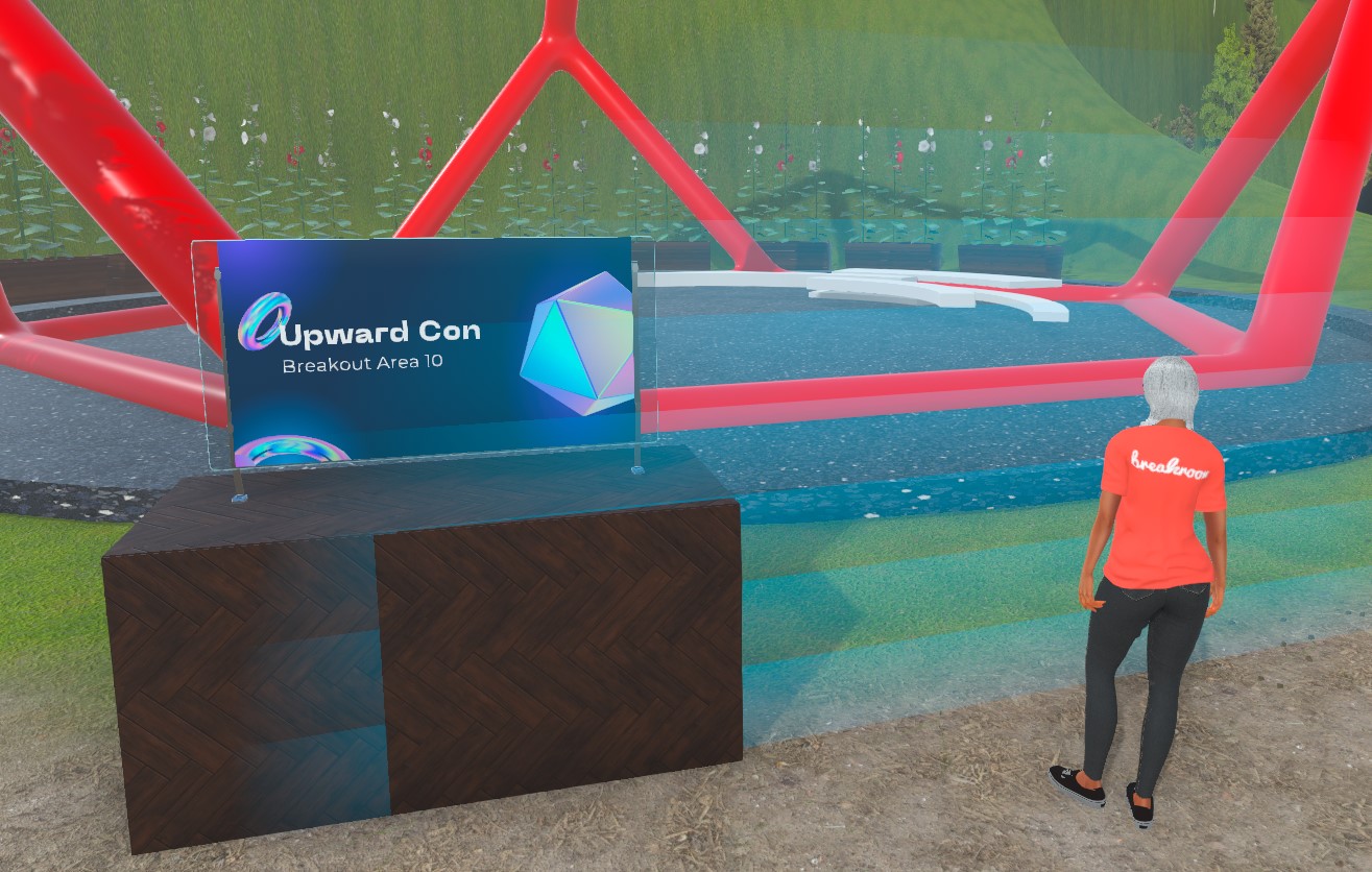 A screenshot of a gray-haired female avatar standing outside a breakout area located in a sculpture garden. A transparent blue voice zone boundary indicator stands in front of her. To her left is an event sign advertising Upward Con.